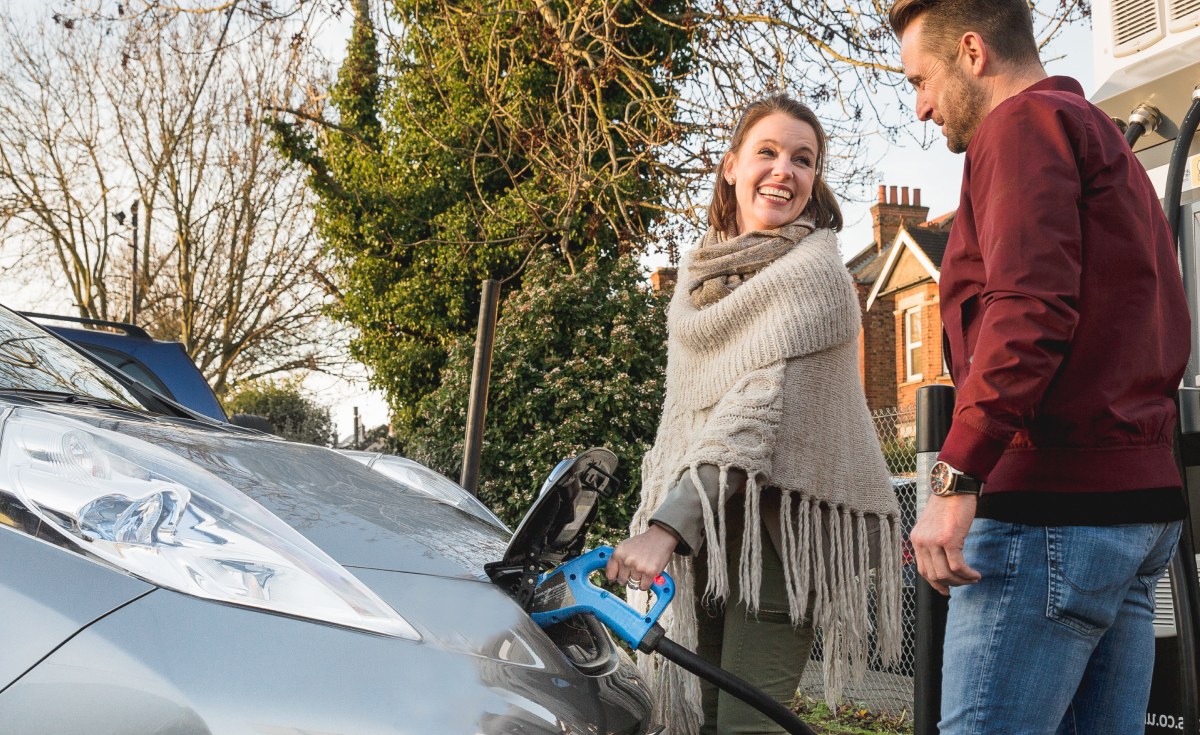 Woman charging EV