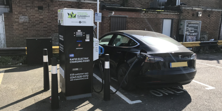 Car charging at ESB Energy Rapid Charge Point in London